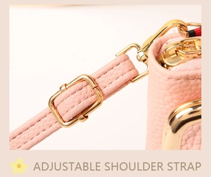 Detail of pink lychee leather mobile bag with adjustable strap and gold metal hardware