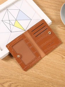 Brown crocodile pattern leather wallet with snap closure and multiple card slots