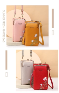 Detail of four colorful phone crossbody bags featuring floral embroidery and metal clasps