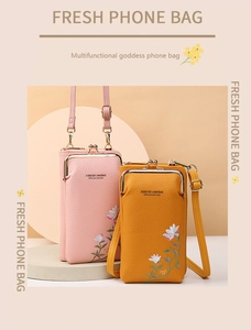 Detail of lychee leather crossbody phone bags with floral embroidery and metal clasp