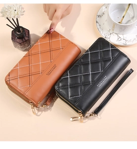 Detail of dual zipper wallets with diamond stitching and detachable wrist straps