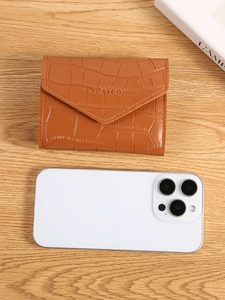 Brown crocodile pattern envelope card holder with BNDAYCON logo on wood background