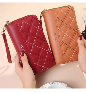 Close-up of quilted PU leather wallets in burgundy and caramel with double zippers