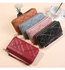 Close-up of quilted leather wallets in five colors with dual zippers and wrist straps