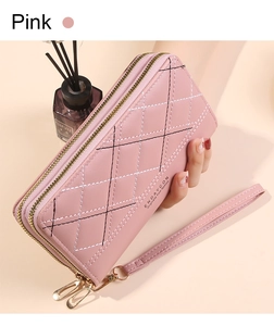 Pink quilted leather clutch with double zippers and gold hardware detail
