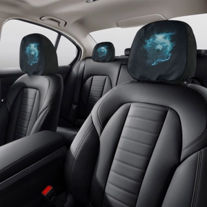 Detail of wolf print car headrest covers showing elastic fabric on black leather seats