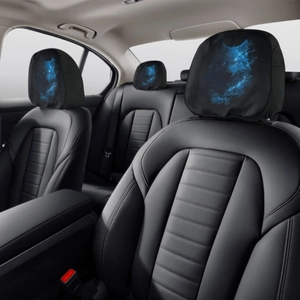 Detailed close-up of universal car headrest covers with glowing blue wolf print on black fabric