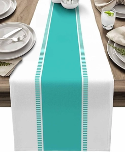 Detail of modern striped table runner with turquoise center band on dark wood dining table
