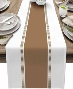 Detailed top view of striped table runner on wooden table with elegant dining setup