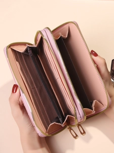 Pink faux leather long double zipper wallet with multiple card slots and internal compartments