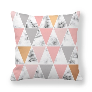 Detail of peach skin fabric pillowcase with geometric marble and pastel triangle patterns