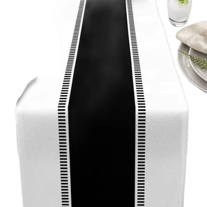 Modern black and white striped table runner made of thick woven cotton linen fabric