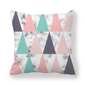 Macro detail of peach skin fabric cushion cover with geometric marble and pink patterns
