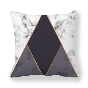 Detail of geometric peach skin pillowcase with white marble texture and gray blocks