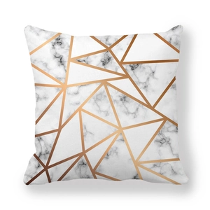 Detailed close-up of marble texture and rose gold geometric lines on soft cushion cover