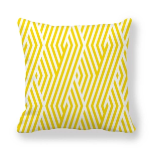Detailed close-up of yellow and white geometric pattern on peach skin fabric pillowcase