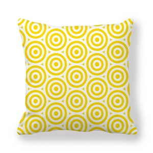 Macro shot of geometric yellow concentric circle pattern on peach skin pillowcase