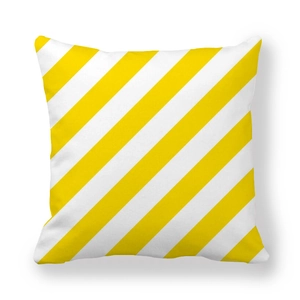 Macro detail of yellow and white diagonal stripes on a soft peach skin cushion cover
