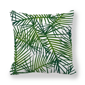 Detailed view of the square pillowcase with dense tropical green palm leaf patterns