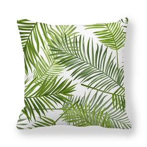 Detail view of tropical green palm leaf pattern on soft white peach skin pillowcase
