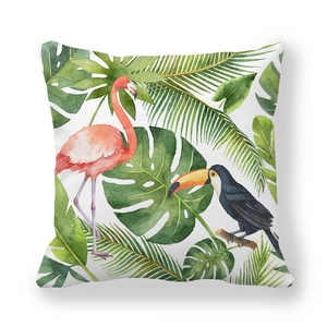 Macro detail of tropical flamingo and toucan print on decorative peach skin pillowcase