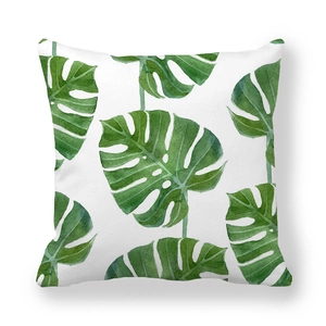Detailed view of the watercolor monstera leaf print on white peach skin pillowcase