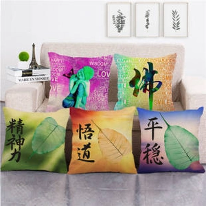 Detailed view of linen cushion covers with zen theme, Buddha motifs and oriental calligraphy