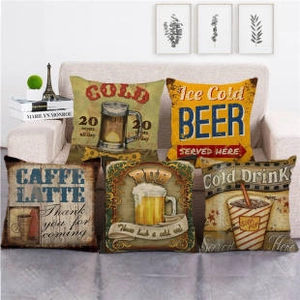 Close-up of vintage American industrial style linen pillow covers with coffee and beer prints