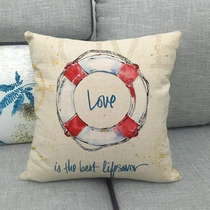 Detail of nautical cushion cover with red lifebuoy print and Love text on linen fabric