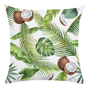 Macro detail of tropical watercolor pillow cover with coconut and palm leaf patterns