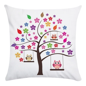Close-up of soft white pillowcase featuring colorful tree and cartoon owl print