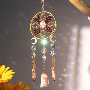 Bohemian suncatcher with red natural stones, moon charms, and a crystal drop pendant