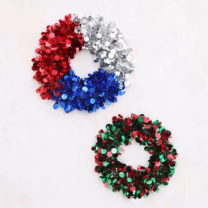 Close-up of red white and blue sequin wreaths for Independence Day and festive wall decor