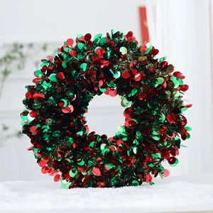 Macro view of patriotic red and blue sequined wreath on a soft white faux fur rug