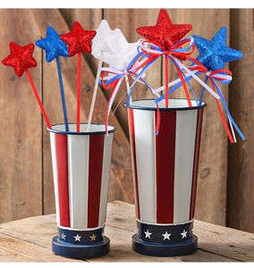 Detail of red white and blue glitter star picks with ribbons for Independence Day decor