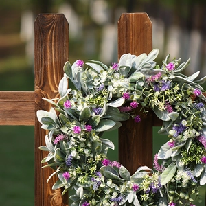 Country style lavender wreath with purple flowers and flocked green leaves on wood fence