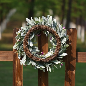 Pastoral lavender and lamb ear leaf wreath on a rustic wooden fence for garden decor