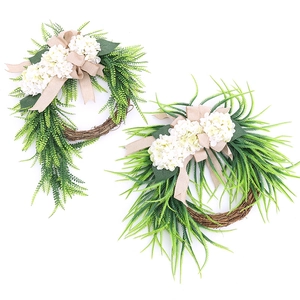 Farmhouse wreath set with white hydrangeas green leaves and burlap bow on vine base