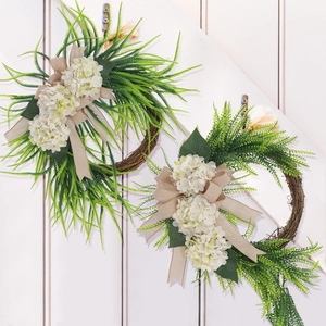 Detail of set of 2 hydrangea wreaths with green fern leaves and rustic burlap bow