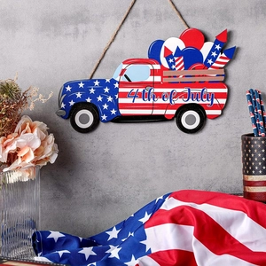 Wooden 4th of July patriotic truck door hanger with red white and blue star patterns