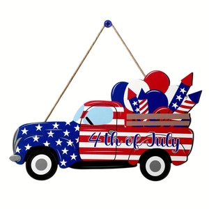 Detailed close-up of a vintage wood truck hanger with 4th of July star and rocket designs