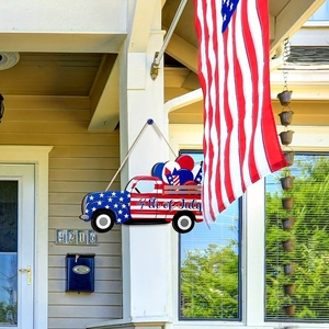 Detail of wooden 4th of July truck door sign featuring American flag design and balloons