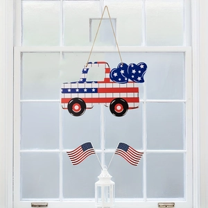 Detail of wooden patriotic American flag truck door sign with stars and stripes motif