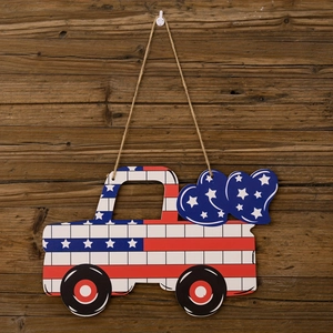 Close-up of patriotic wooden pickup truck door hanger with US flag stars and stripes pattern