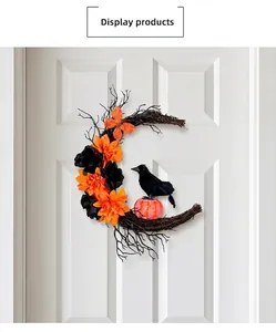 Detail view of a Halloween crescent wreath with a black crow, orange flowers and small pumpkins