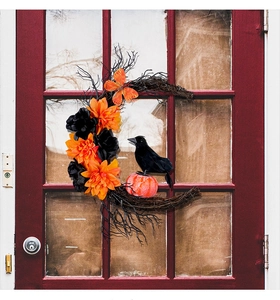 Halloween crescent moon wreath with black crow, pumpkin, and orange flowers on red door