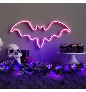 Neon pink bat-shaped wall light decoration for Halloween parties and spooky room decor