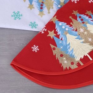 Red and white Christmas tree skirt with glittery gold stars and snowflake patterns