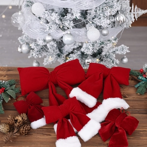 Large red velvet Christmas bows with white faux fur trim for holiday tree decorations
