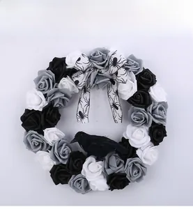 Gothic Halloween wreath with black and white roses, a crow model and spider bow decoration